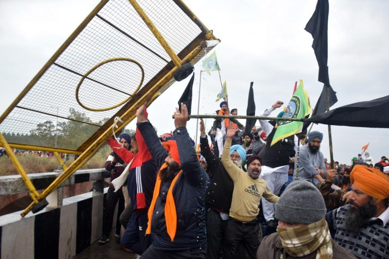 Angry farmers in India clash with police to protest new laws