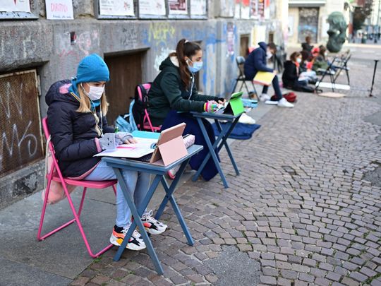 Photos: Italian pupil protests school closure with street learning