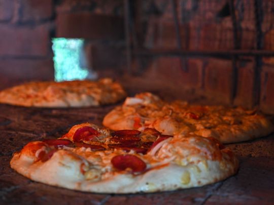 Pandemic pizza: Malaysian family cooks up solution to virus woes