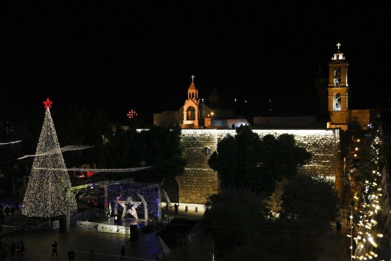 Bethlehem lights up Christmas tree as virus rules keep crowds away