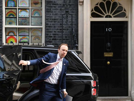 Tougher UK COVID-19 curbs may last some time, health minister suggests