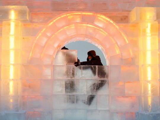 Photos: China ‘mines’ ice from river to build frozen castles, pagoda