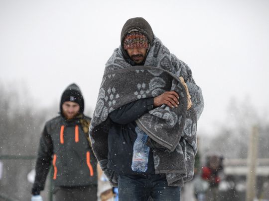 Photos: Hundreds of migrants freezing in heavy snow in Bosnia camp