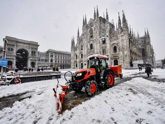 Photos: Rare snowfall blankets locked-down Milan