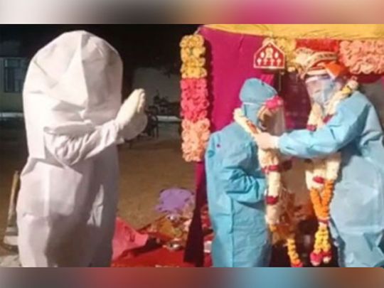 In sickness and health: Indian couple ties knot in PPE kits after bride tests positive for COVID-19