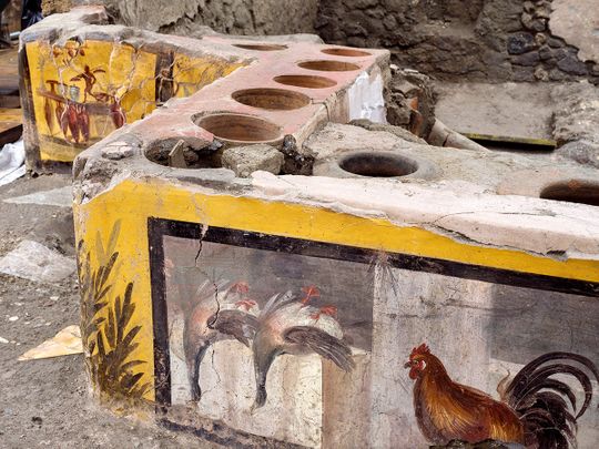 Photos: Archaeologists uncover ancient street food shop in Pompeii
