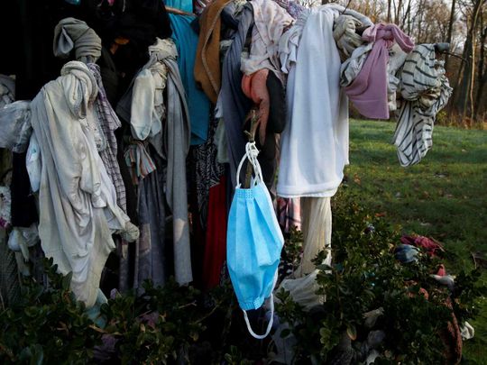 COVID-19 masks adorn healing trees in updated pagan rite in France