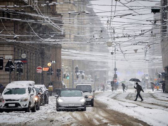 Milan snowbound as storms hit Italy