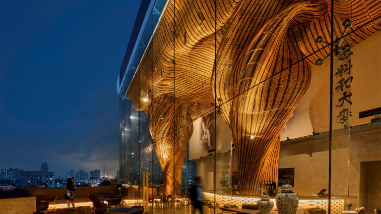 Swirling Plumes of Black-and-Gold Rattan Fill the Ceiling of a Bangkok Lounge