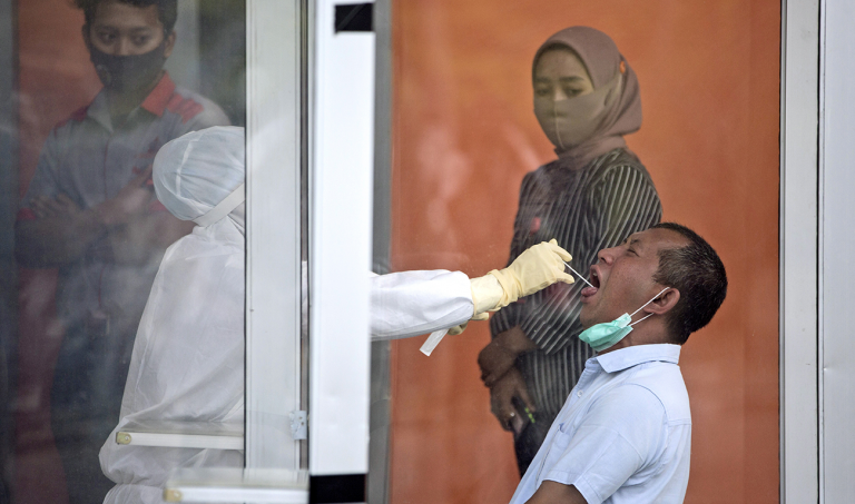 Indonesia gets tough on COVID vaccine skeptics as phase two of inoculations begins