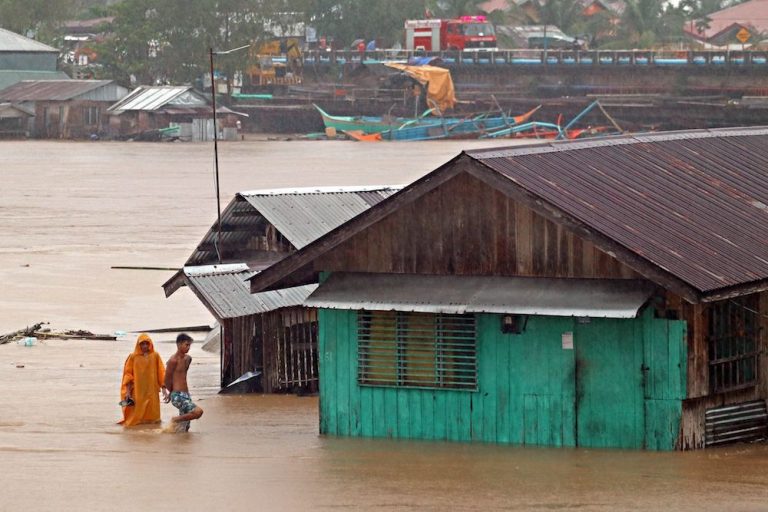 Thousands flee as south Philippines storm submerges homes
