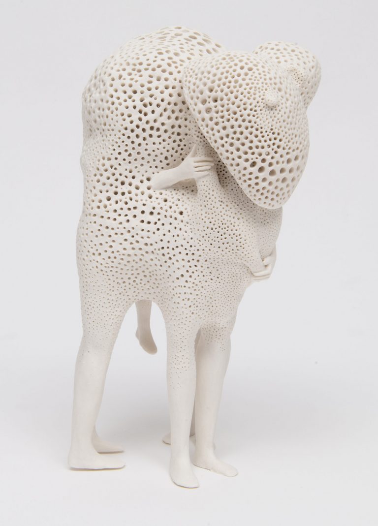 Abstract Masses of Porcelain Consume Embracing Figures in Sculptures by Artist Claudia Fontes