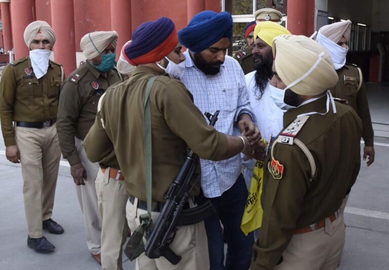 Indian farmers mark 100th day of protest with road blockade