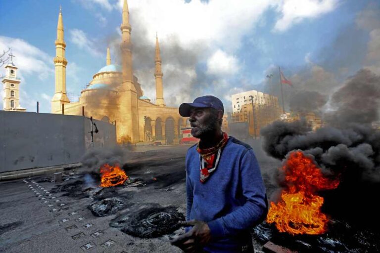 Lebanese president calls on army to prevent protesters blocking roads