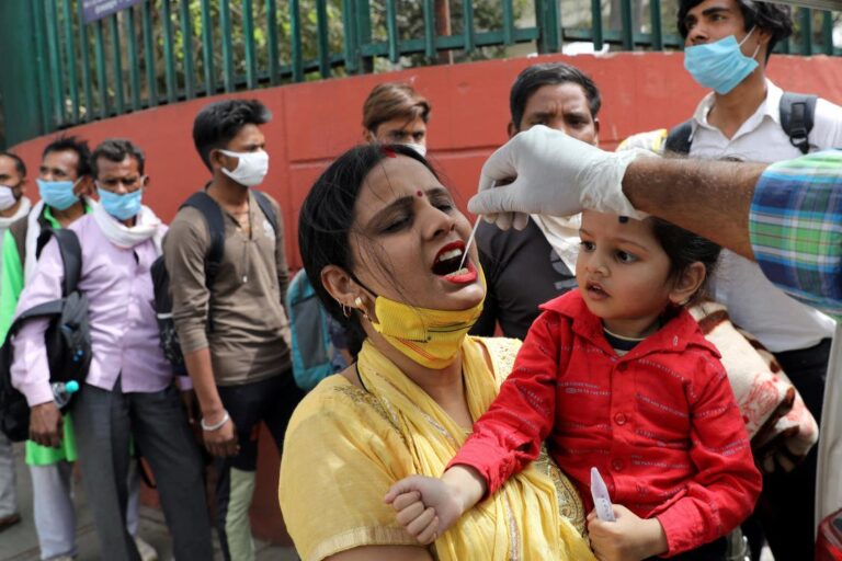India coronavirus cases surge to four-month high, some lockdowns return