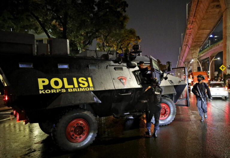 Woman killed after pointing gun in Indonesia police HQ