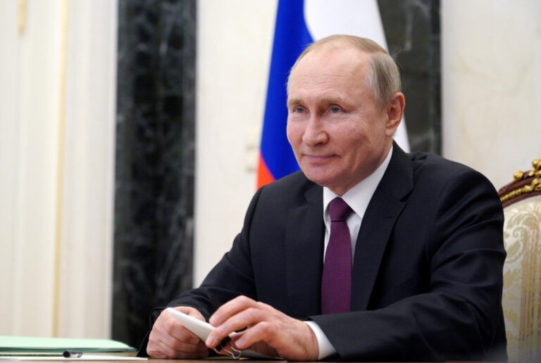 Putin signs law allowing him to serve two more terms