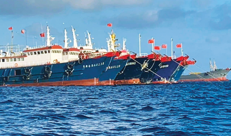Manila summons Chinese envoy over reef dispute