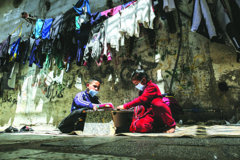 Gaza gravediggers and medics stretched as COVID-19 spikes