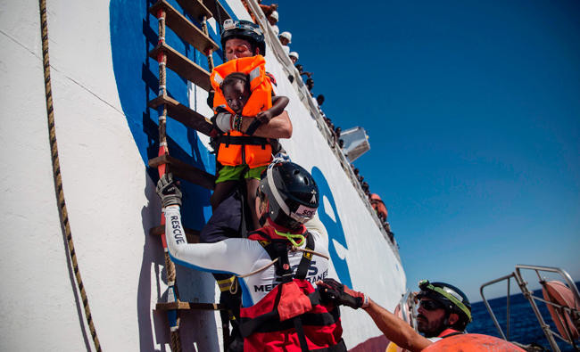 Italy says Libyan coast guard fired on its fishing boats, injuring captain