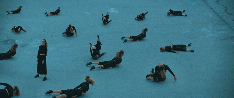 Duplicate Figures Freeze in Motion as a Dancer Writhes and Contorts Her Body in an Entrancing Short Film