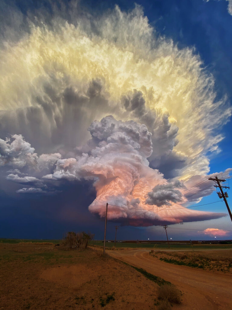 A Candy-Colored Cloud Hovers Over a West Texas Landscape Mid-Thunderstorm