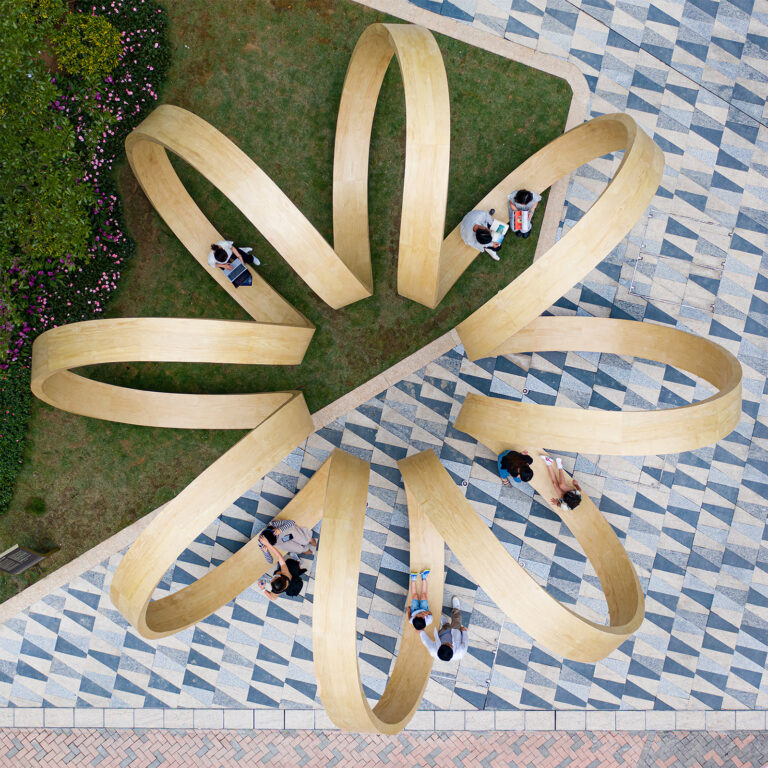 Sleek Wooden Ribbons Spiral in an Infinitely Looping Installation in Hong Kong