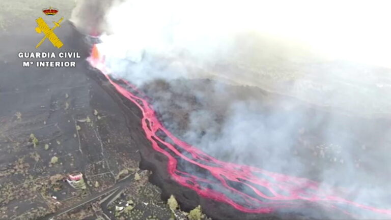 Lava from Spanish island volcano rolls slowly toward the sea