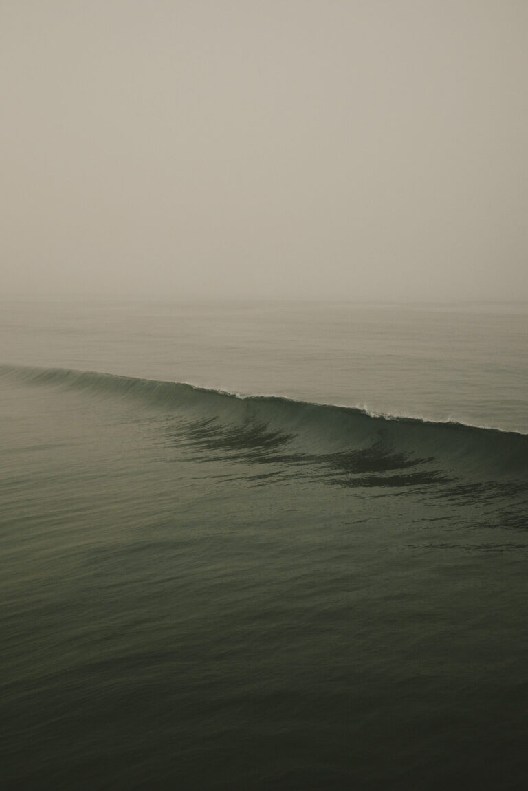 Eerie Photos Frame the Dense Fog Shrouding Waves as They Swell Along the Los Angeles Coast