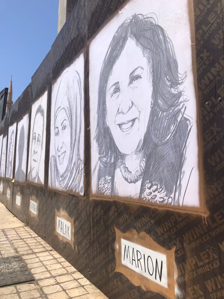 Beirut blast memorial wall covered in portraits of victims