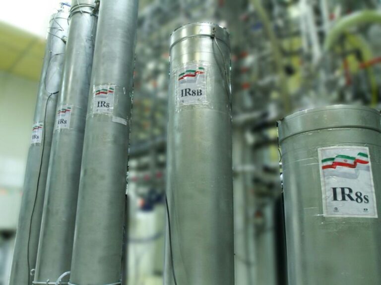 France urges Iran to curb nuclear activity, resume talks