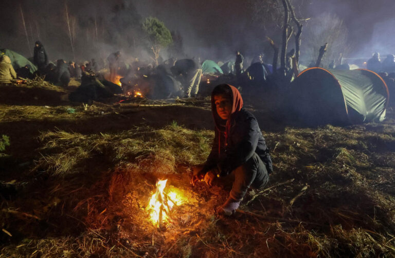 Poland detains 100 migrants at border, accuses Belarus