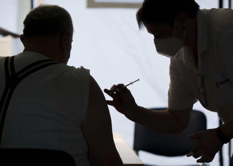 EU should make COVID booster shot a condition for free travel, Greek PM says