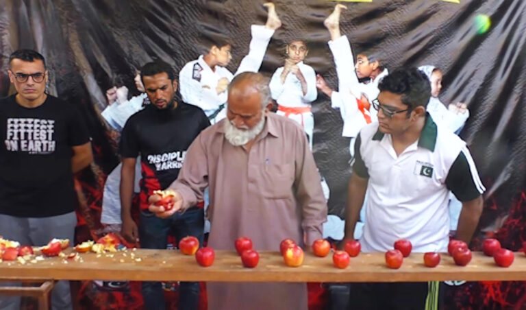 Septuagenarian Pakistani creates record for crushing apples by hand