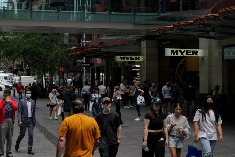 Australia omicron variant spreads, testing reopening plans