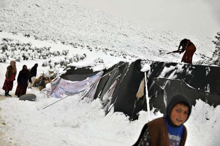 Storm blankets Syrian tented camps in snow, at least one child dead