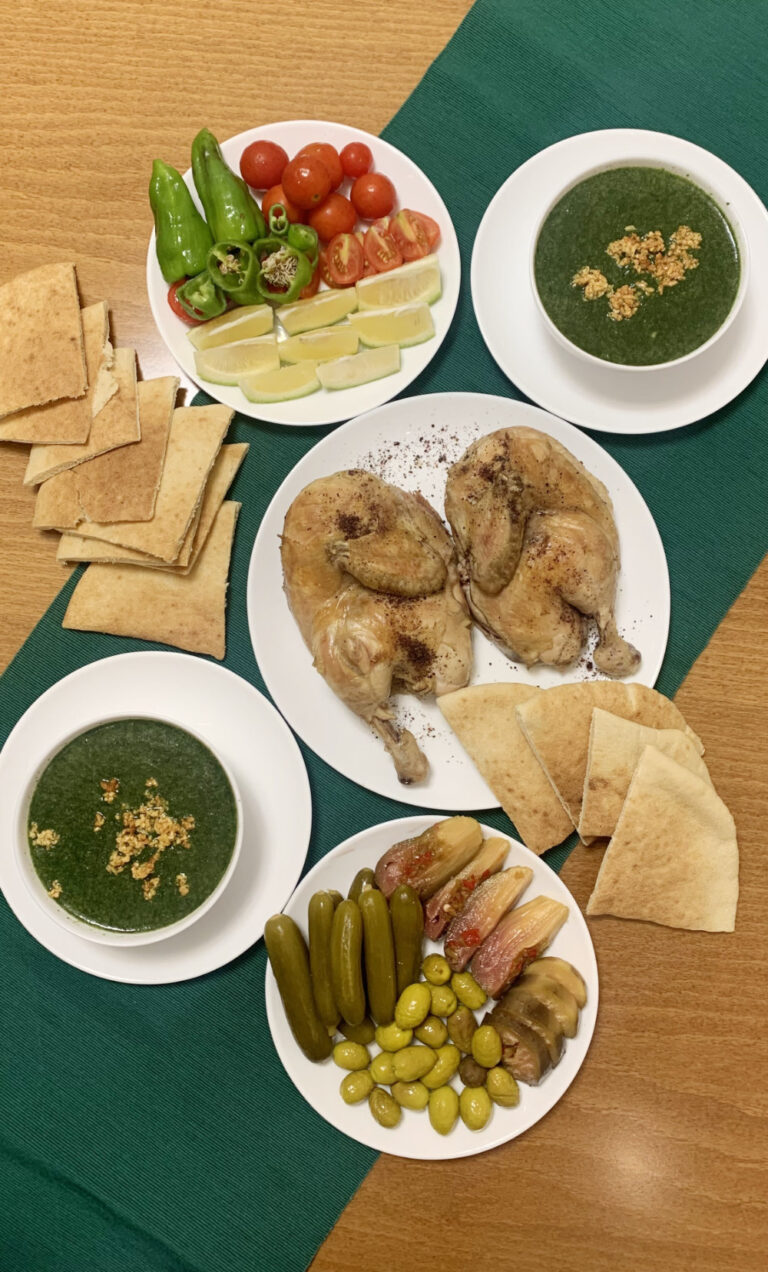 Dinner tables turn green and white in Palestine on the first day of Ramadan