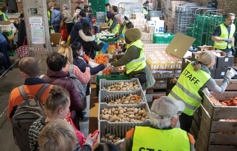 Ukrainian refugees queue for food in wealthy Switzerland