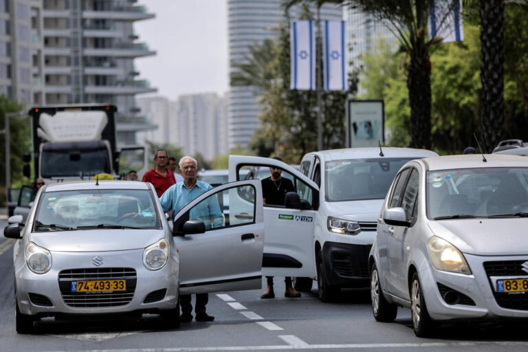 Israel commemorates war dead with nationwide pause, sirens