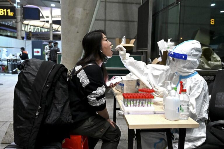 China removes some COVID-19 test rules on travelers from US