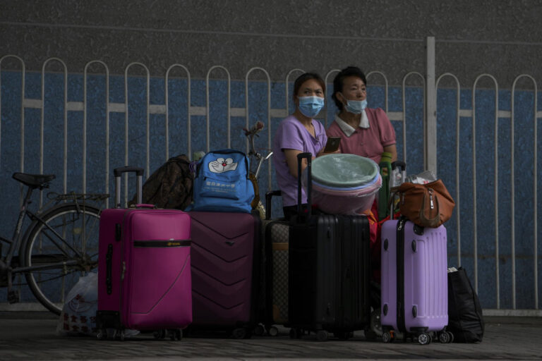 China halves quarantine time for overseas travelers