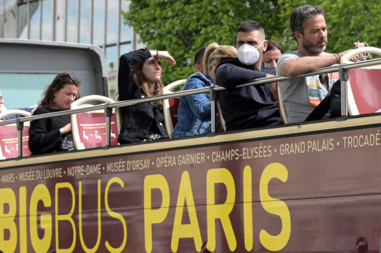 With hospitalizations up, France weighs return to masks