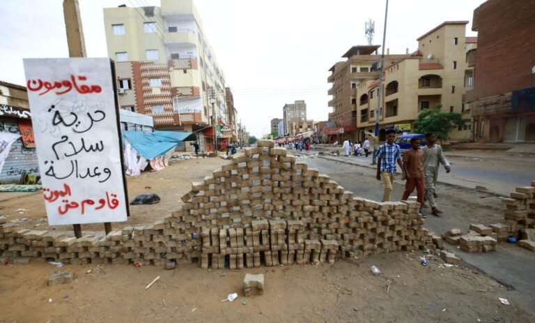Khartoum democracy activists lift half of sit-ins