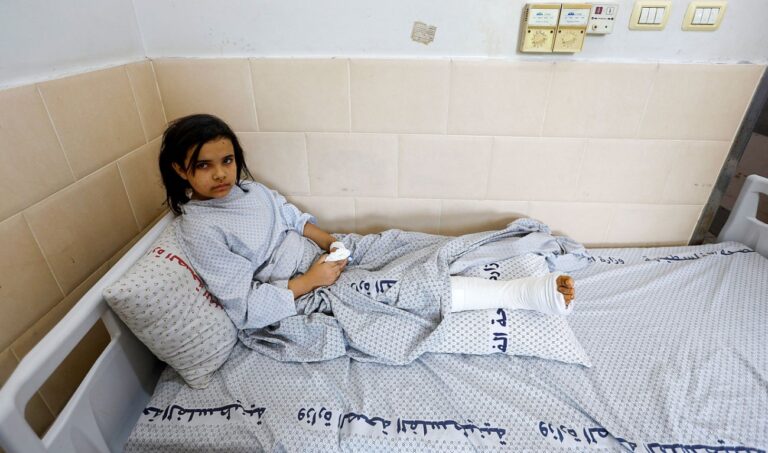 Palestinians sift through rubble at Gaza camp hit in Israeli strike