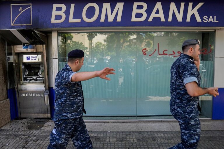 Armed depositor storms Beirut bank, takes trapped savings