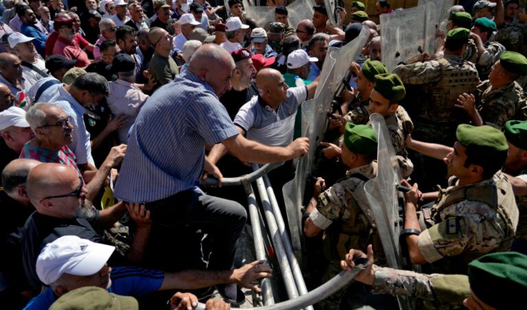 Lebanon retirees scuffle with police near Parliament as MPs approve budget
