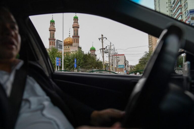 China’s vast Xinjiang hit with COVID-19 travel restrictions