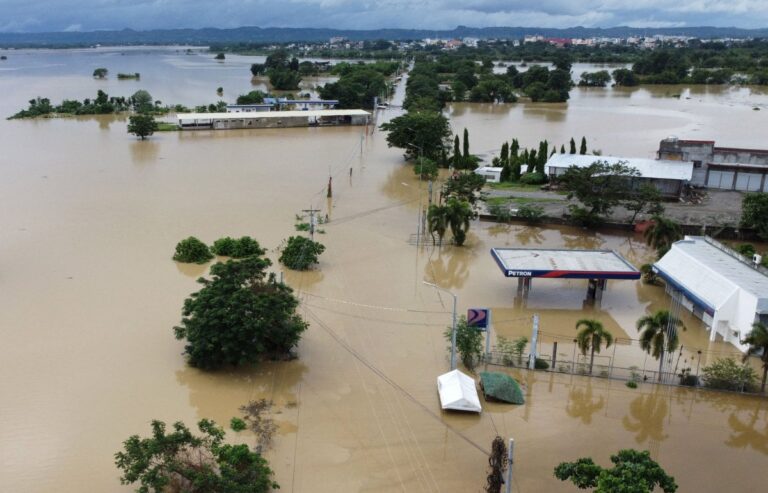 Nearly 100 dead, dozens missing in storm-ravaged Philippines